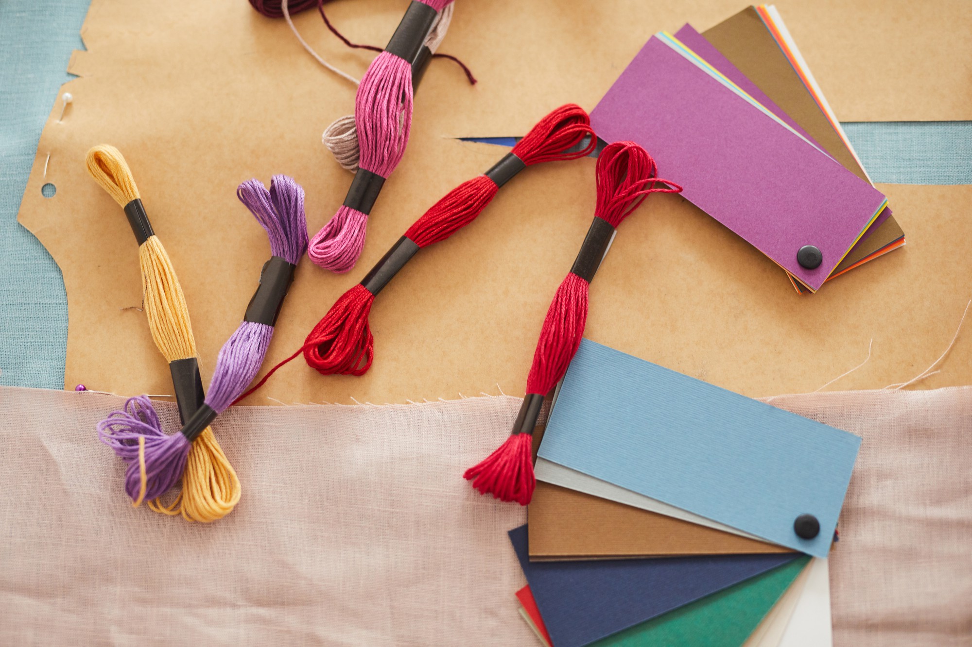 Flatlay of thread cards and small embroidered samples