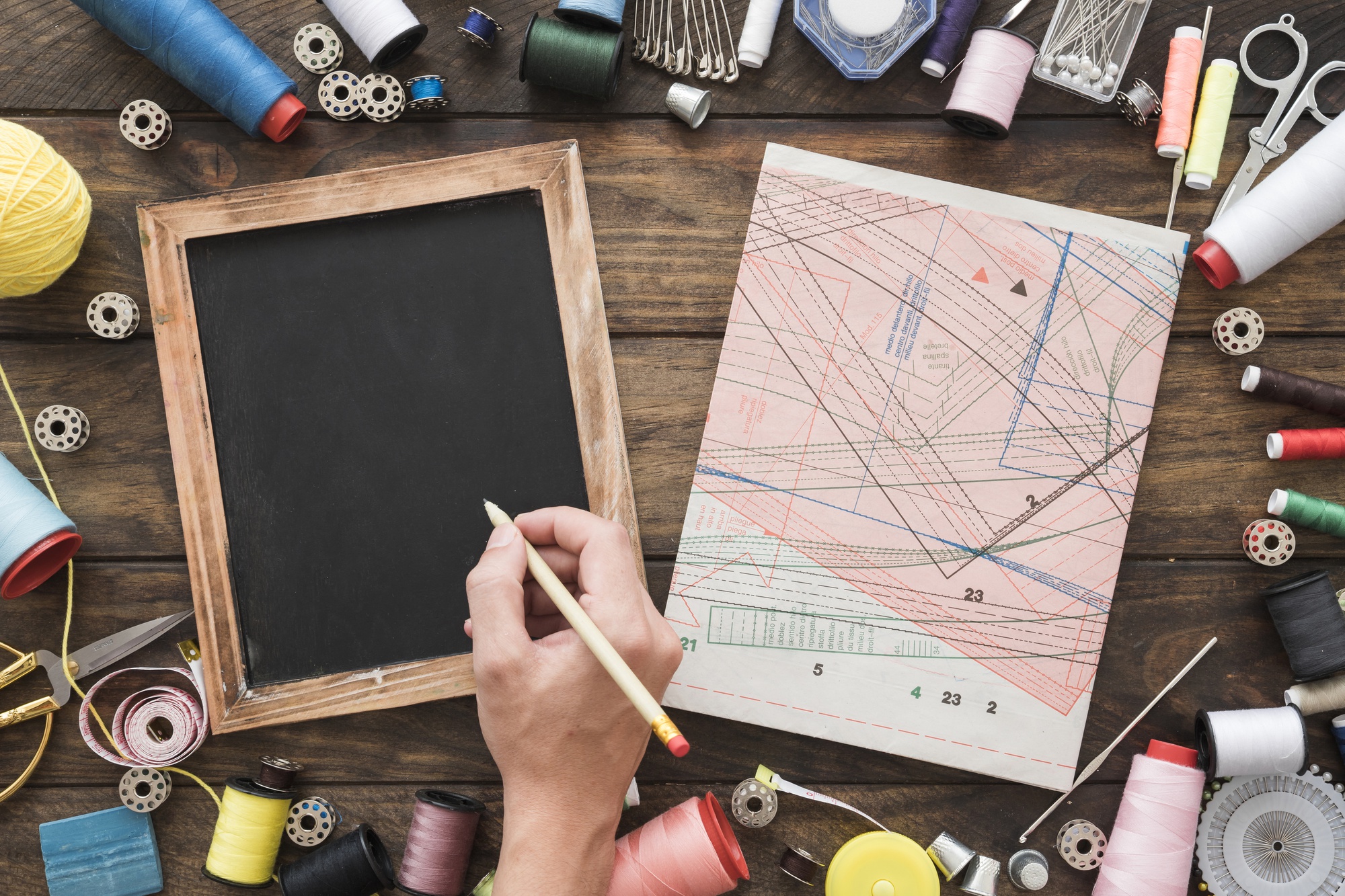 Thread samples and stitch diagrams on table